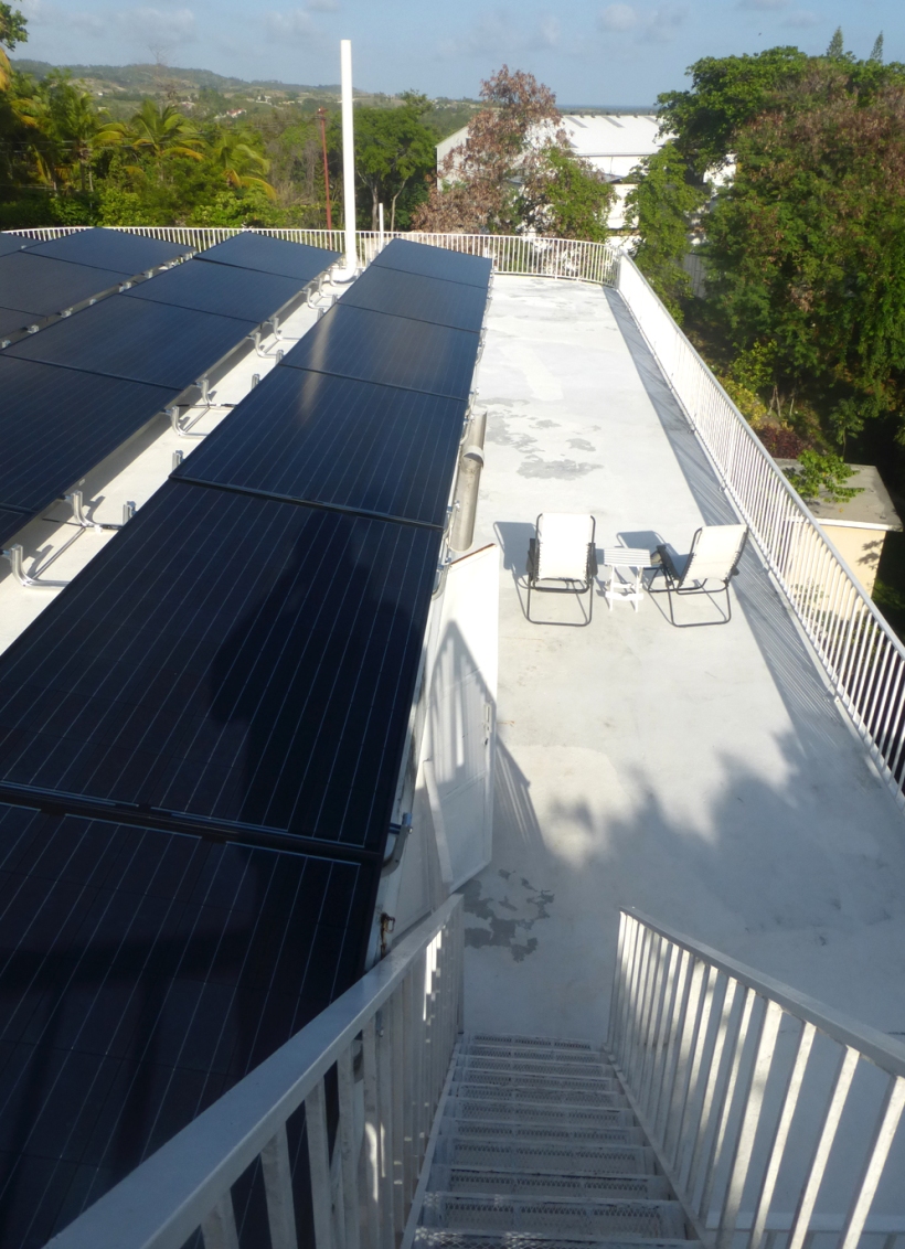 The solar panels cover the entire second story flat roof!