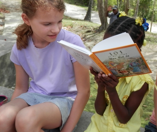 Enjoying a story from the Creole 101 Favorites storybook!